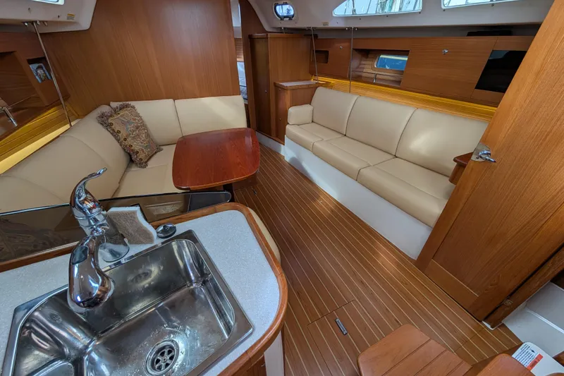 Slide: The Image of Interior of 2021 Catalina 315 yacht with modern wood finish and comfortable seating. - 2