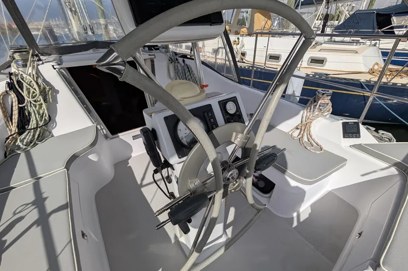 Slide: The Image of Cockpit of 2021 Catalina 315 sailboat with steering wheel and navigation instruments. - 30