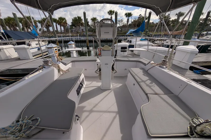 Slide: The Image of 2021 Catalina 315 sailboat cockpit with seating, docked at marina. - 31