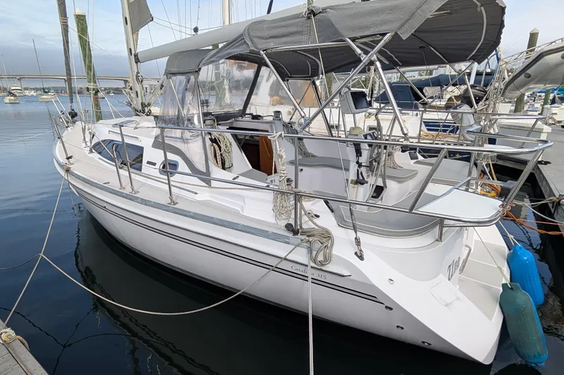 Slide: The Image of 2021 Catalina 315 sailboat docked in marina, featuring sleek design and modern amenities. - 45
