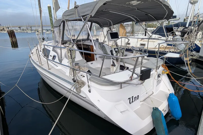 Slide: The Image of 2021 Catalina 315 sailboat docked, featuring spacious cockpit and sleek design. - 46