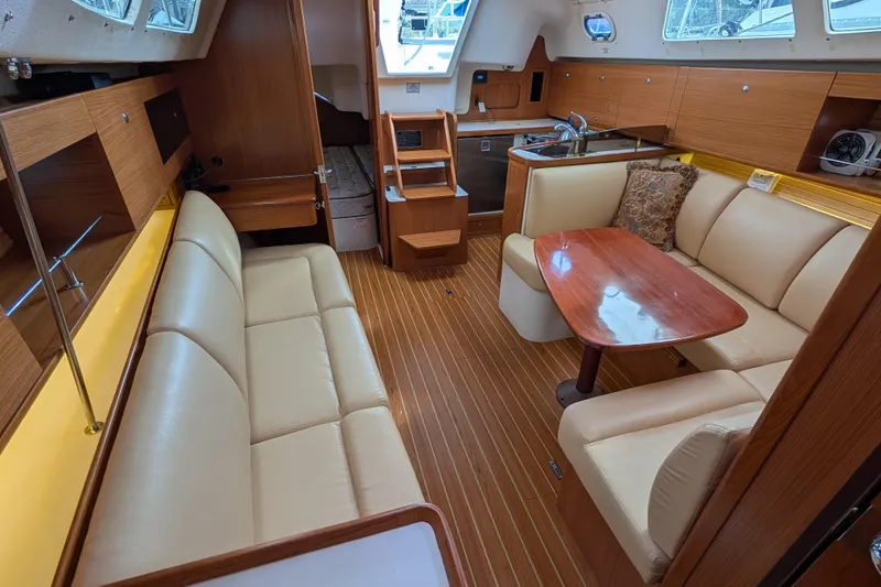 Slide: The Image of 2021 Catalina 315 yacht interior with elegant wood finish and comfortable seating. - 5