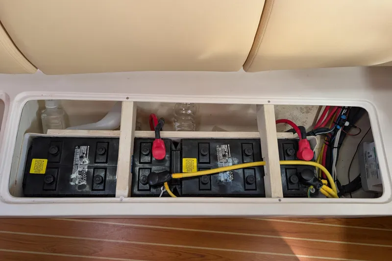 Slide: The Image of Engine compartment of a 2021 Catalina 315 sailboat, showcasing hoses and mechanical components. - 50