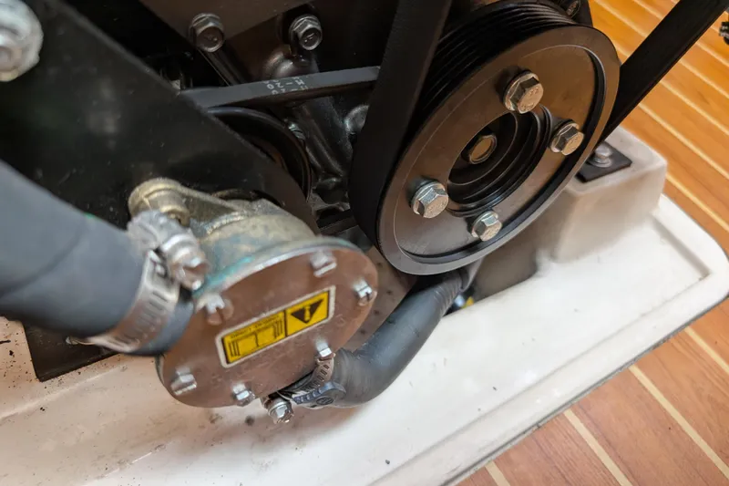 Slide: The Image of Engine compartment of a 2021 Catalina 315 sailboat featuring a Yanmar engine. - 53