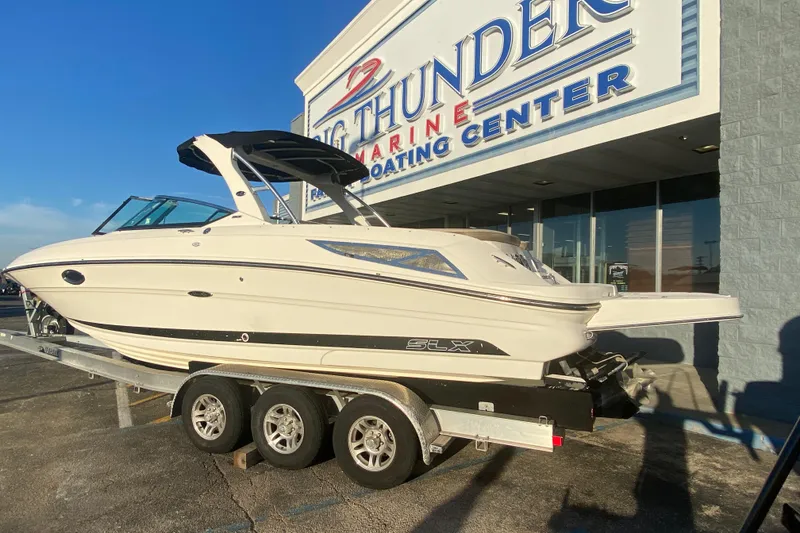 Slide: The Image of 2012 Sea Ray 300 SLX boat on trailer at Big Thunder Marine. - 13