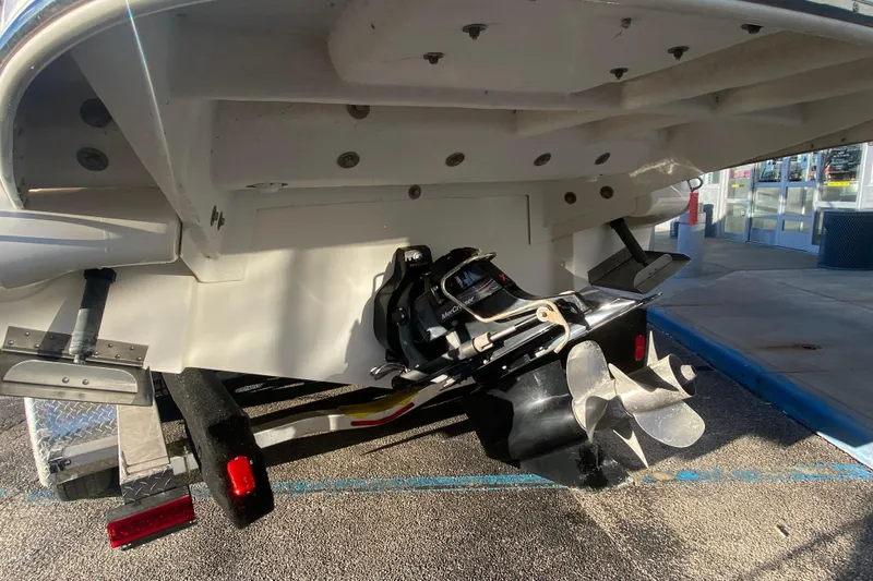 Slide: The Image of Rear view of a 2012 Sea Ray 300 SLX boat with propeller and trailer. - 14