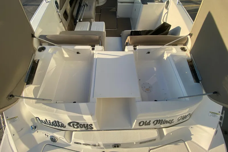 Slide: The Image of 2012 Sea Ray 300 SLX boat interior with seating and storage compartments. - 21