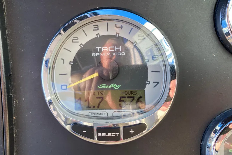 Slide: The Image of Tachometer of 2012 Sea Ray 300 SLX showing 576 hours and 11.7 volts. - 29