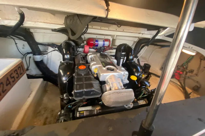 Slide: The Image of Engine compartment of a 2012 Sea Ray 300 SLX boat, showcasing mechanical components. - 31
