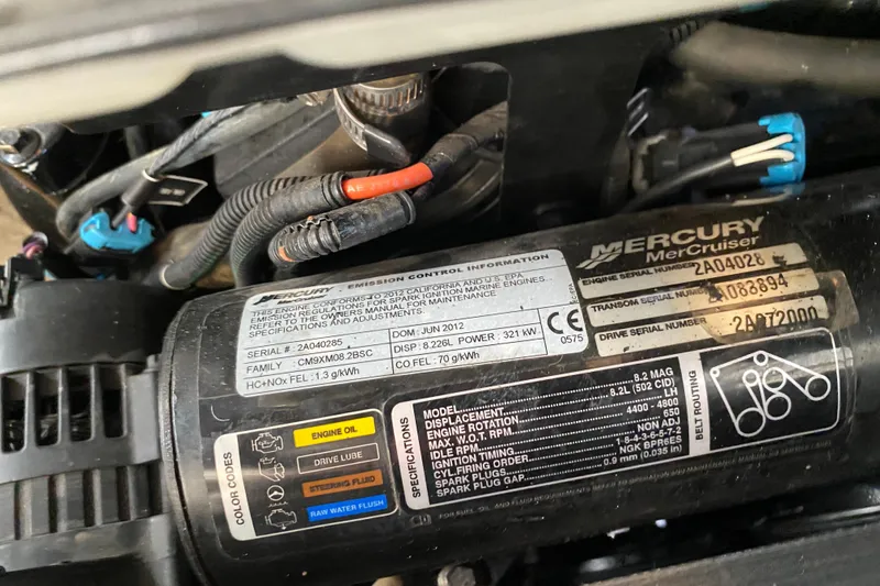 Slide: The Image of Engine label of a 2012 Sea Ray 300 SLX with Mercury MerCruiser specifications. - 32