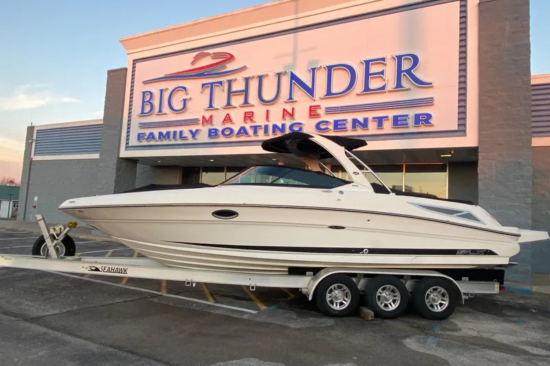 Slide: The Image of 2012 Sea Ray 300 SLX boat on trailer at Big Thunder Marine center. - 39