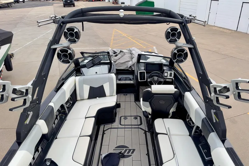 Slide: The Image of 2020 Malibu Wakesetter 23 MXZ interior with sleek seating and advanced audio system. - 4