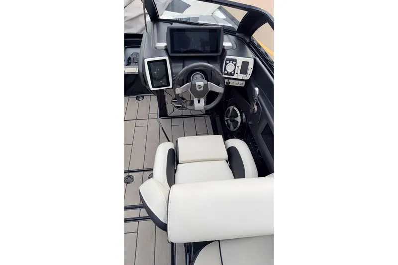 Slide: The Image of 2020 Malibu Wakesetter 23 MXZ cockpit with modern controls and sleek design. - 5