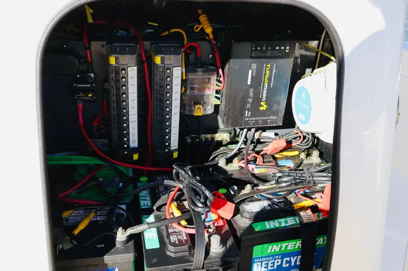 Slide: The Image of Electrical system of a 2022 ShearWater 23LTZ boat, featuring batteries and wiring. - 16