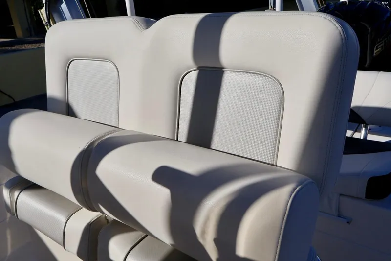 Slide: The Image of 2022 ShearWater 23LTZ boat seats with light upholstery and modern design. - 9