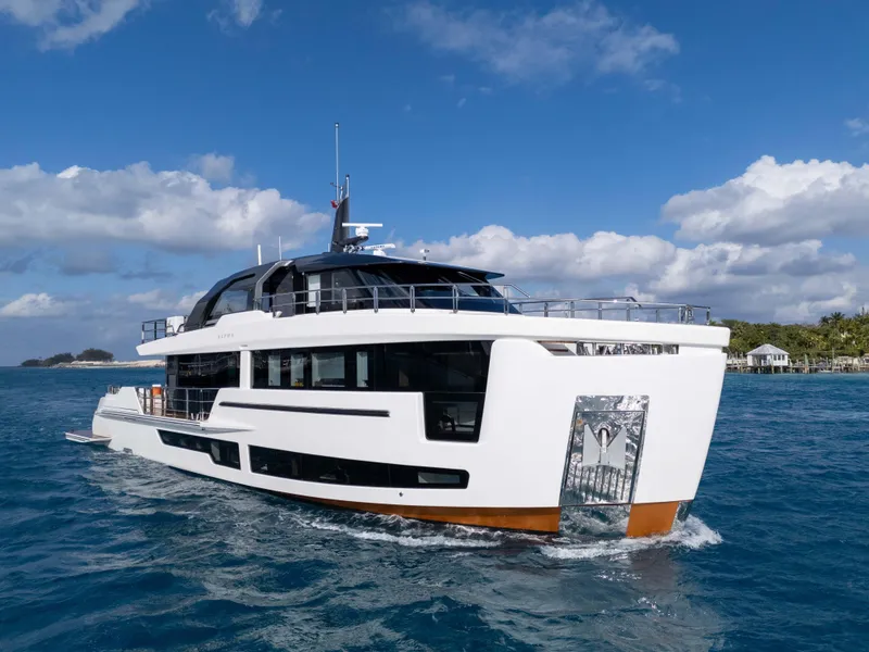 Slide: The Image of Luxurious 2025 Alpha 100 Squalo Co Ownership yacht cruising on open sea. - 2