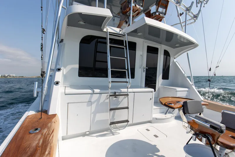 Slide: The Image of 2003 Hatteras 60 Convertible yacht on open sea. - 10