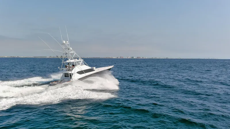 Slide: The Image of Hatteras 60 Convertible 2003 yacht on open sea. - 22