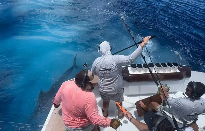 Slide: The Image of Anglers on Hatteras 60 Convertible fishing boat, 2003 model. - 3