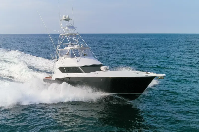 Slide: The Image of 2003 Hatteras 60 Convertible yacht cruising on open sea. - 37