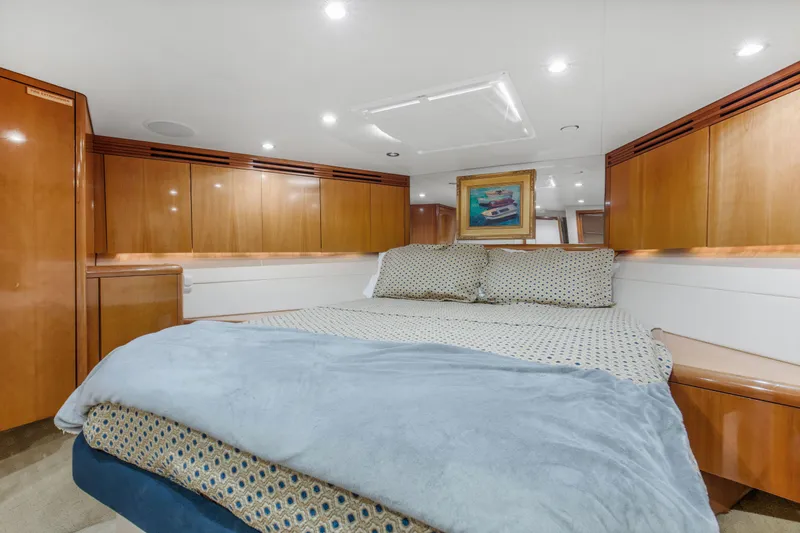 Slide: The Image of Luxurious bedroom on a 2003 Hatteras 60 Convertible yacht. - 46