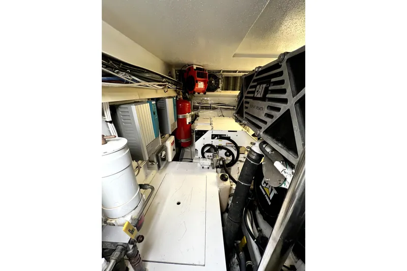 Slide: The Image of Engine room of 2003 Hatteras 60 Convertible yacht with CAT marine power. - 79