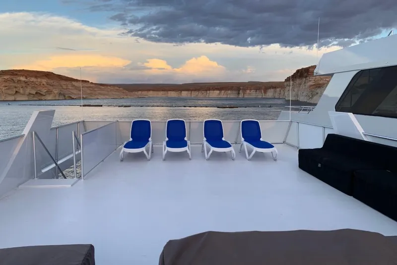 Slide: The Image of Luxurious deck view on Adonia Utopia Trip #8, featuring blue lounge chairs, 2019. - 17