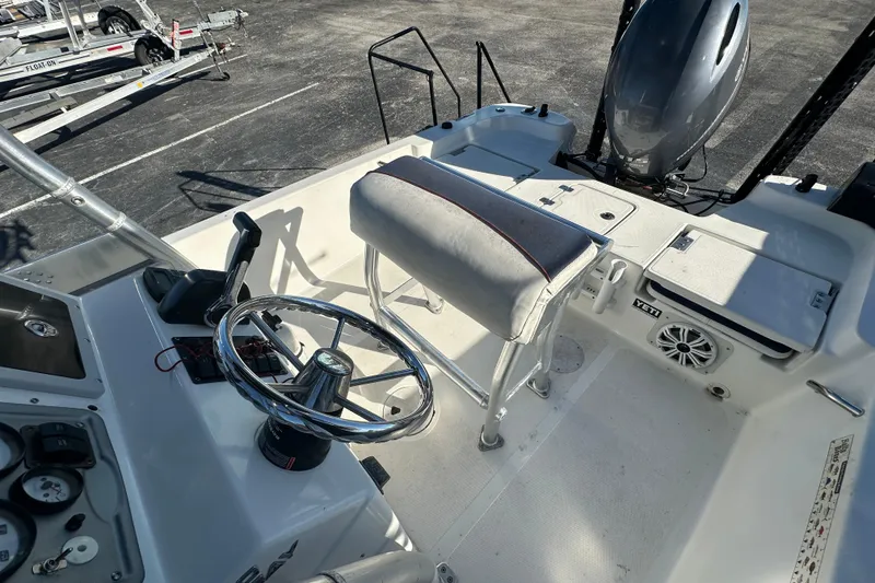 Slide: The Image of 2015 NauticStar 1810 NauticBay boat interior with steering wheel and seating. - 11