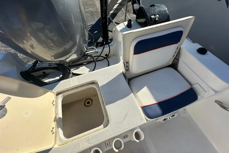 Slide: The Image of 2015 NauticStar 1810 NauticBay boat interior with storage compartment and seating. - 12