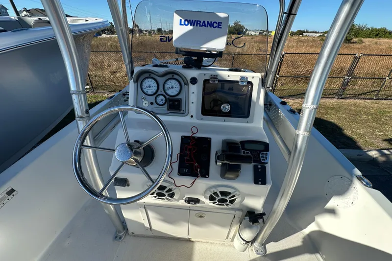 Slide: The Image of 2015 NauticStar 1810 NauticBay boat console with steering wheel and navigation equipment. - 5