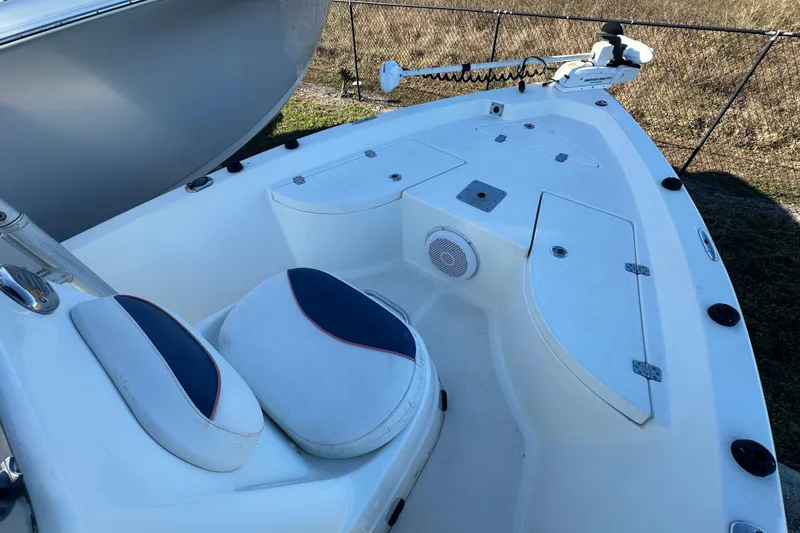 Slide: The Image of 2015 NauticStar 1810 NauticBay boat interior with seating and storage compartments. - 6