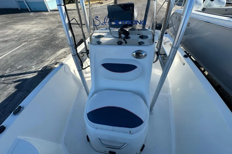 Slide: The Image of 2015 NauticStar 1810 NauticBay boat interior with seating and console. - 9