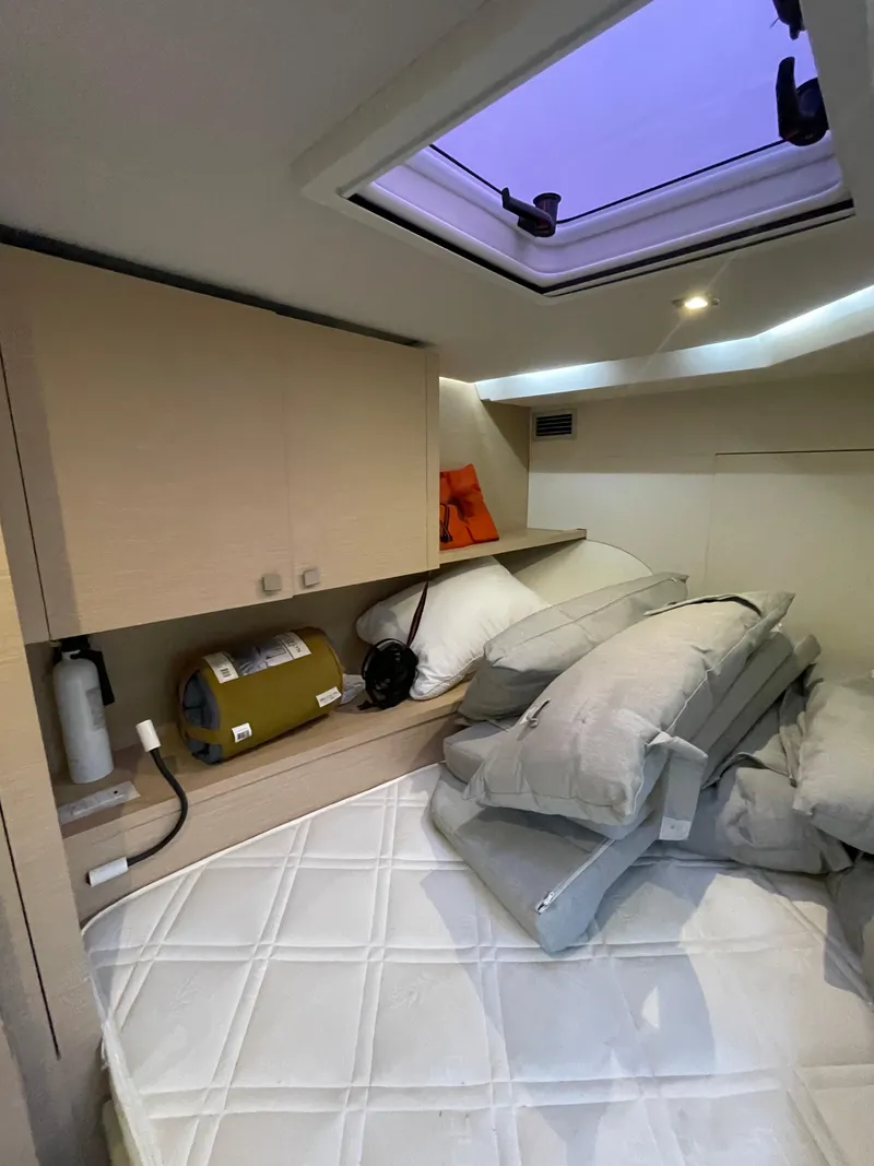 Slide: The Image of Cozy cabin interior of 2018 Fountaine Pajot MY 37 with skylight and storage. - 12