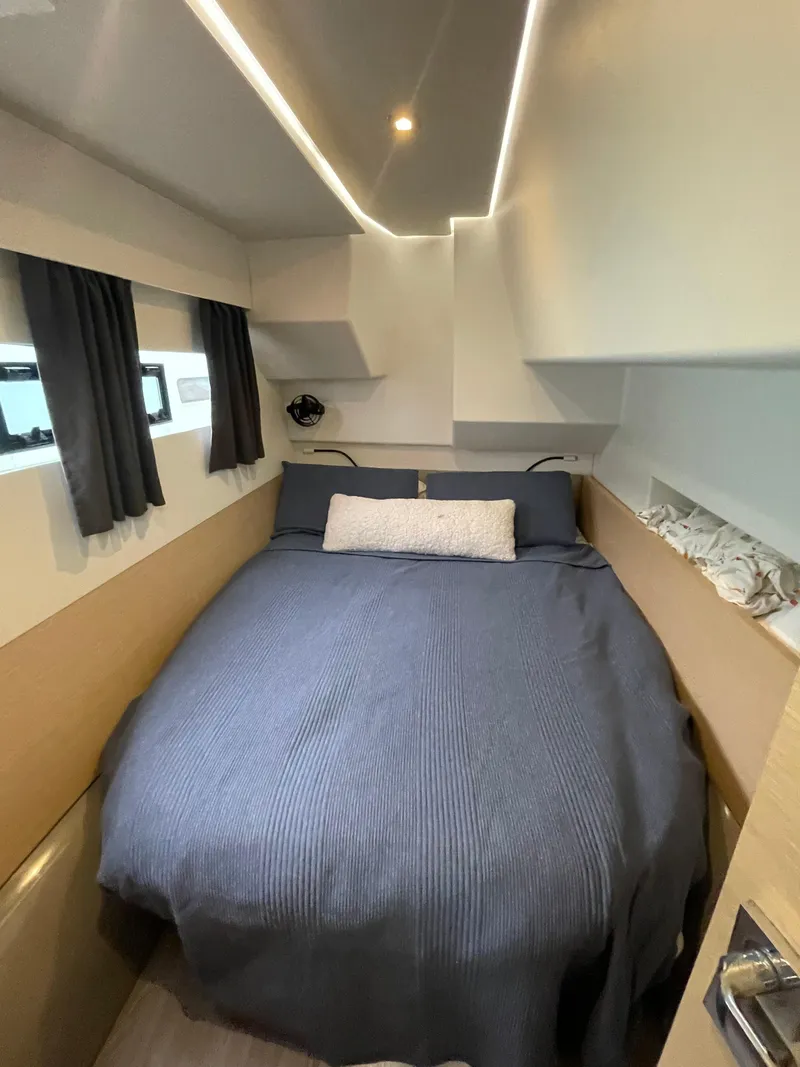 Slide: The Image of Cozy cabin interior of 2018 Fountaine Pajot MY 37 with modern bedding and ambient lighting. - 14