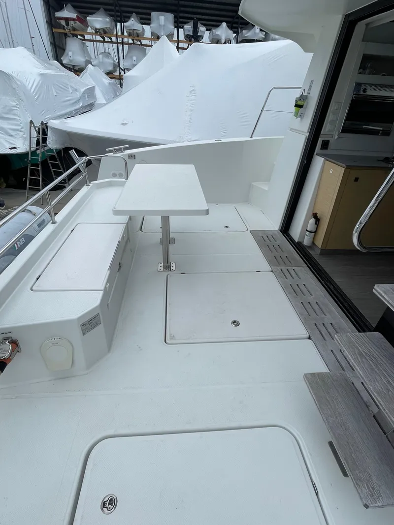 Slide: The Image of 2018 Fountaine Pajot MY 37 yacht deck with seating and table, showcasing modern design. - 27