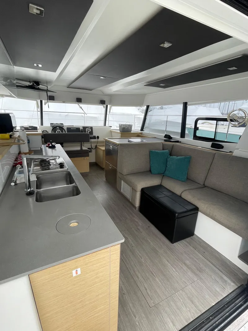 Slide: The Image of Modern interior of 2018 Fountaine Pajot MY 37 yacht with sleek kitchen and cozy seating area. - 32