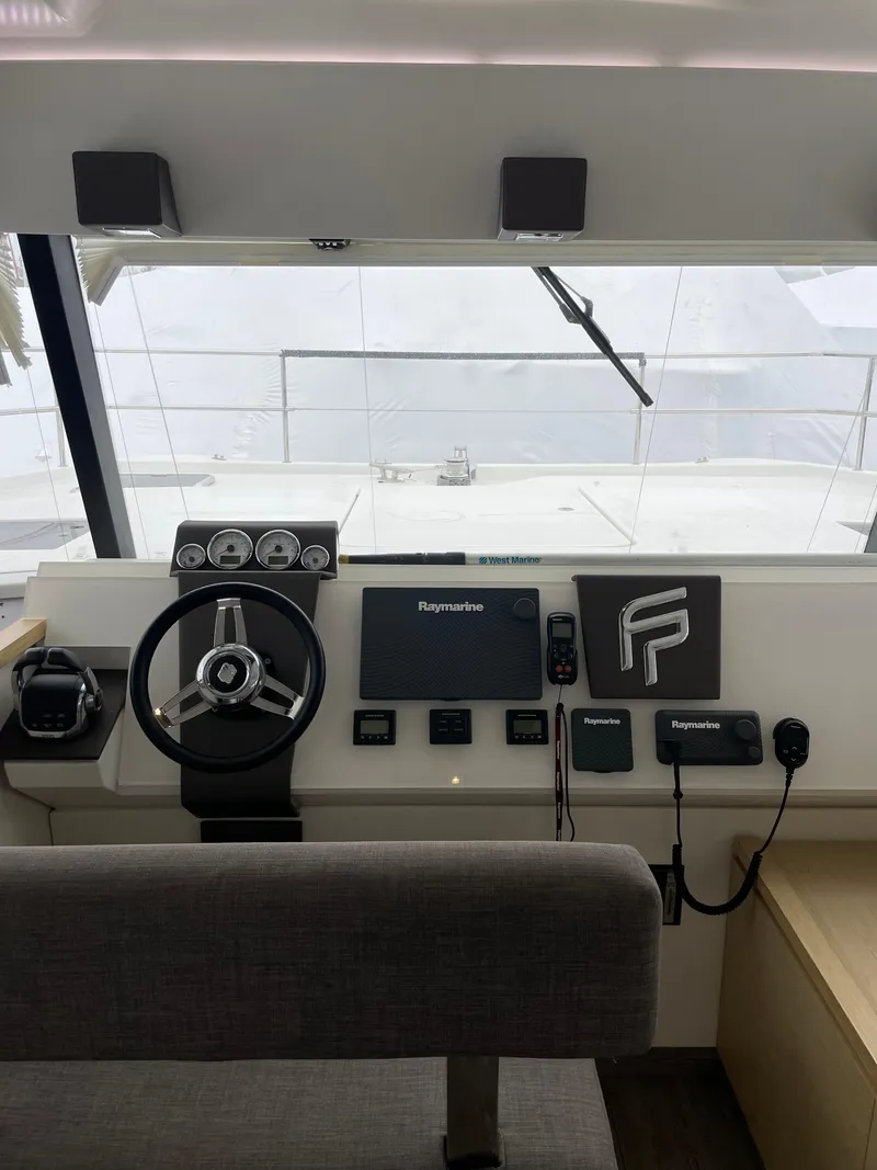 Slide: The Image of Helm of 2018 Fountaine Pajot MY 37 yacht with steering wheel and navigation controls. - 7