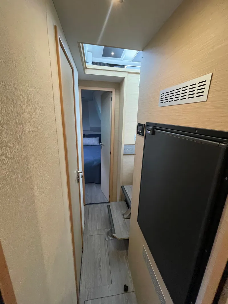Slide: The Image of Interior hallway of 2018 Fountaine Pajot MY 37 yacht, featuring modern design and compact layout. - 11