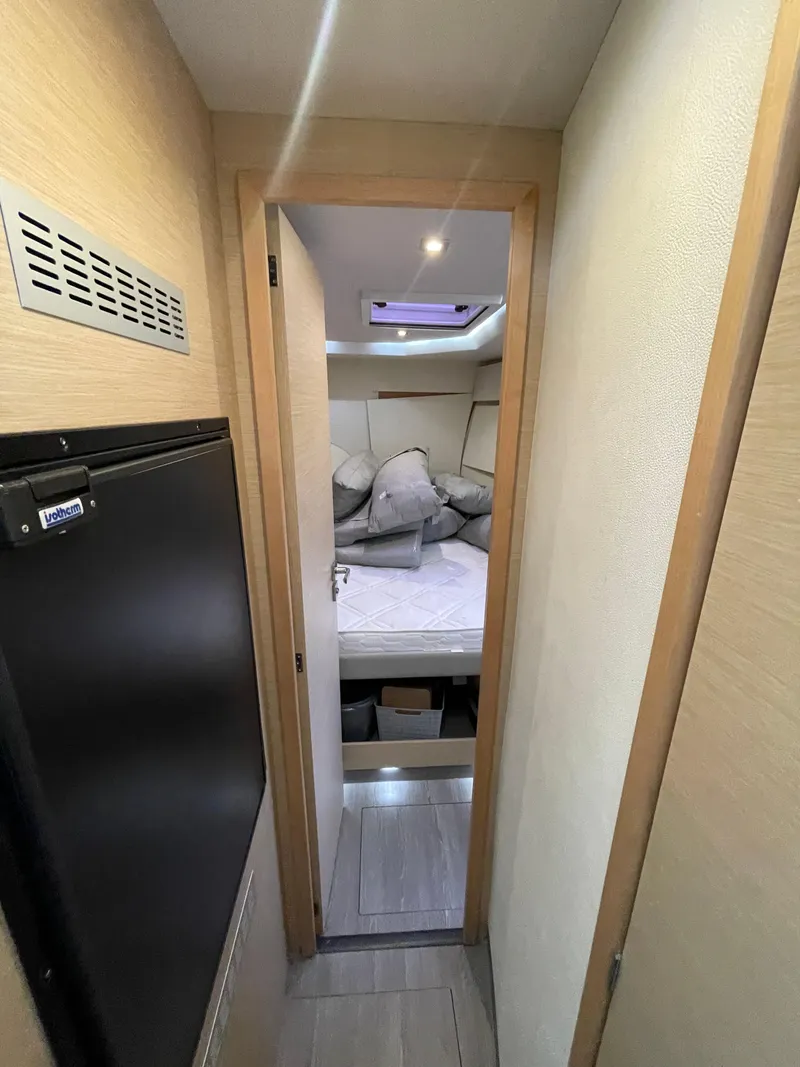 Slide: The Image of Cabin interior of 2018 Fountaine Pajot MY 37 yacht, featuring a cozy bed and modern design. - 13