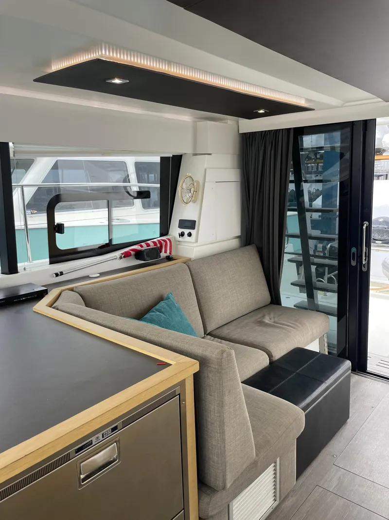 Slide: The Image of Interior of 2018 Fountaine Pajot MY 37 yacht with modern seating and large windows. - 15