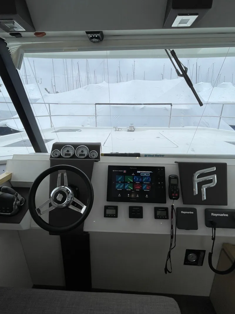 Slide: The Image of 2018 Fountaine Pajot MY 37 helm with modern controls and navigation equipment. - 21