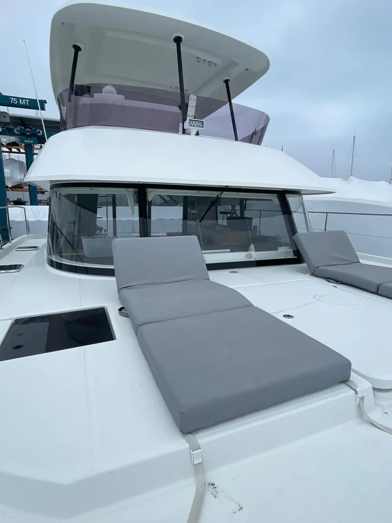 Slide: The Image of 2018 Fountaine Pajot MY 37 yacht with gray sun loungers on deck. - 30