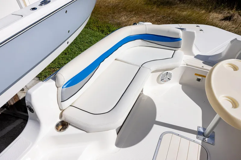 Slide: The Image of 2008 Key West 210 LS boat interior with white and blue seating. - 10
