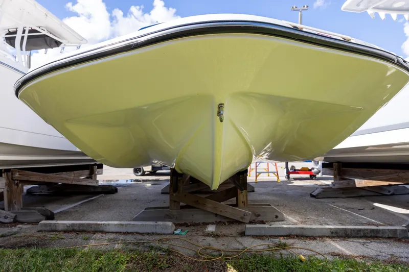 Slide: The Image of 2008 Key West 210 LS boat hull on dry dock, viewed from below. - 2