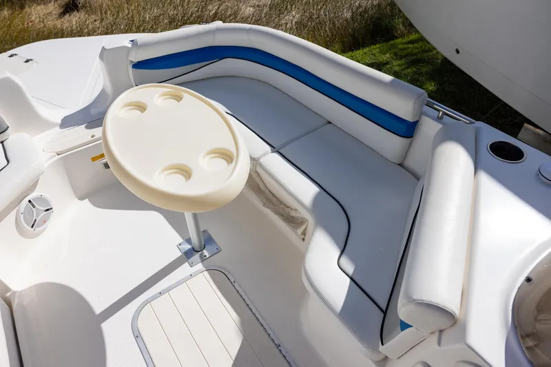 Slide: The Image of Interior of 2008 Key West 210 LS boat with seating and round table. - 9
