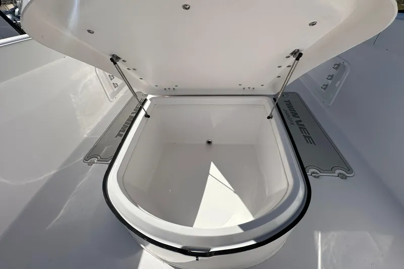 Slide: The Image of Open storage compartment on 2026 Twin Vee 340 GFX CC boat. - 10