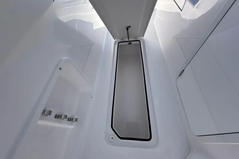 Slide: The Image of 2026 Twin Vee 340 GFX CC boat interior with storage compartment and sleek design. - 11