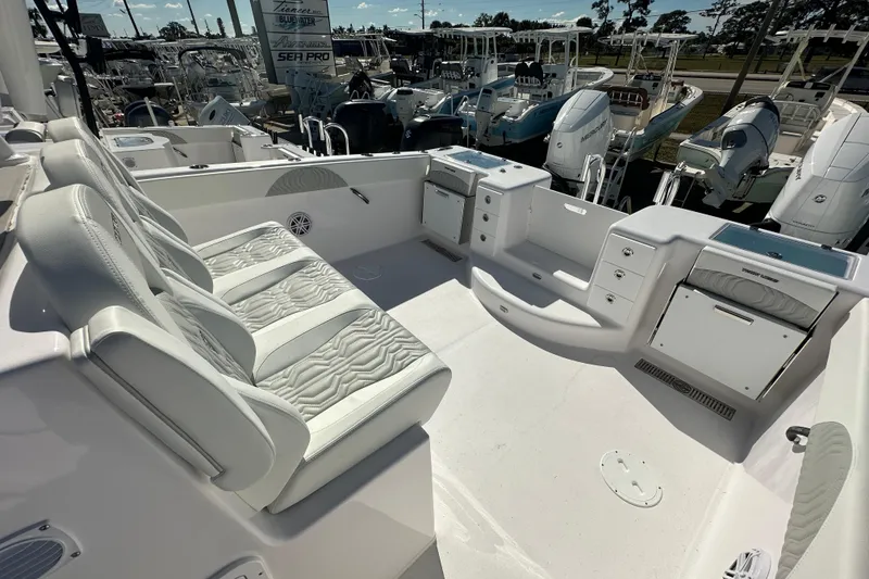 Slide: The Image of 2026 Twin Vee 340 GFX CC boat interior with seating and storage compartments. - 14