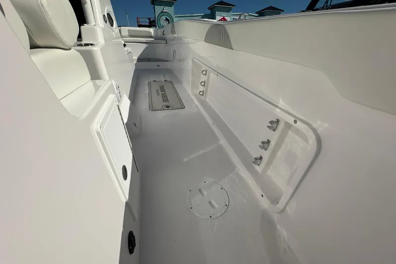 Slide: The Image of 2026 Twin Vee 340 GFX CC boat interior, showcasing sleek white design and spacious layout. - 17