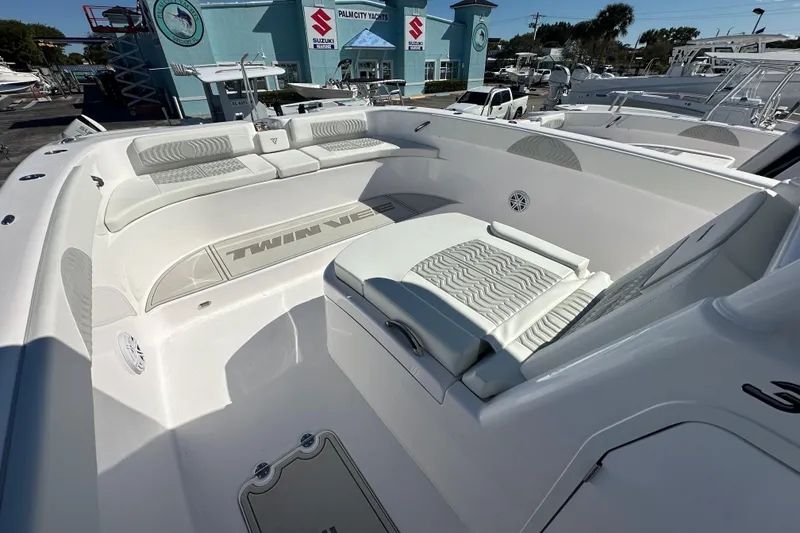 Slide: The Image of 2026 Twin Vee 340 GFX CC boat interior with cushioned seating and sleek design. - 8